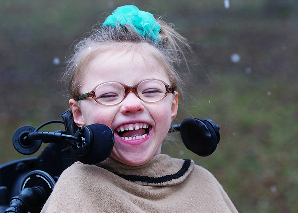 Girl in custom wheelchair with switch access