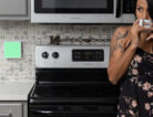 photo of a woman drinking coffee in her kitchen