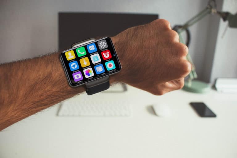 a man wearing SpeechWatch Pro on his wrist up close