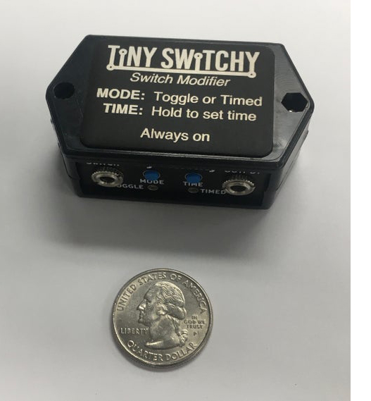 Tiny Switchy Box next to a quarter for size comparasion