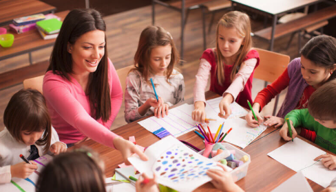 Kids playing a game around table