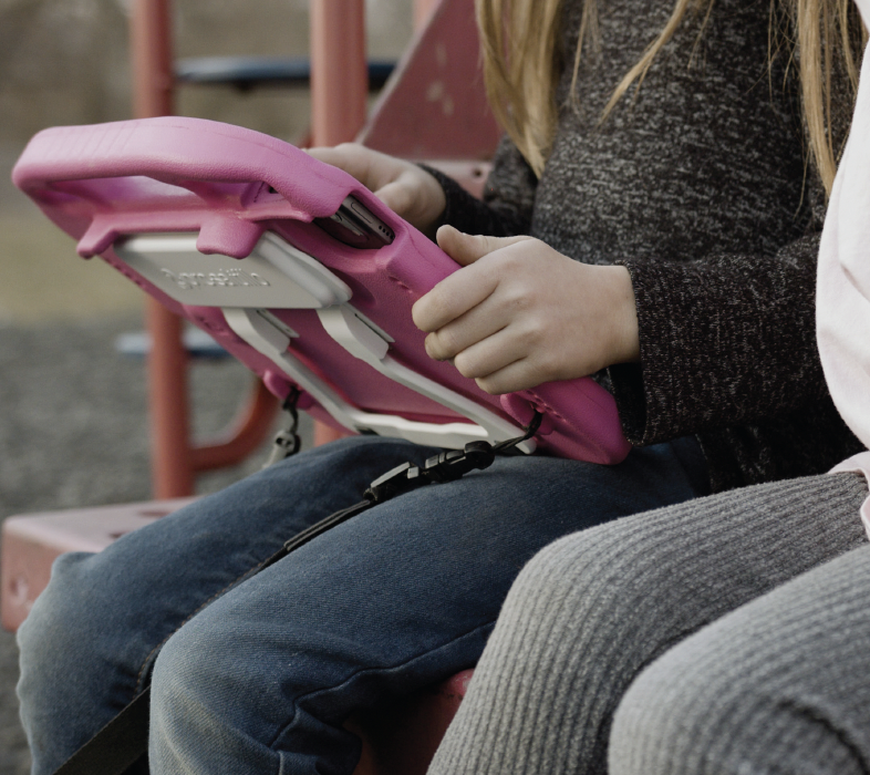 iPad with VersaWrap with a child holding it on lap