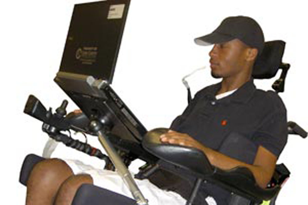 CJT Mounting Solution for a adult male in a wheelchair.